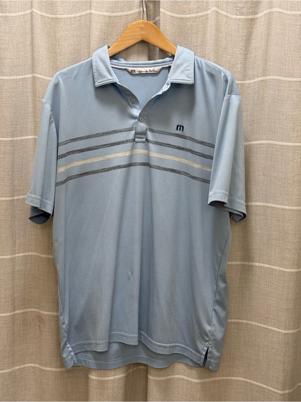 Travis Mathew Light Blue Polo with Gray and Cream Stripe Accents